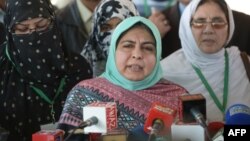 Amina Masood Janjua, chairwoman of Defense Of Human Rights Pakistan, and family members of the missing address the press outside the Supreme Court building after a hearing in Islamabad on December 6. 