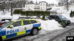 Police secures the area around the house where Sergei Skvortsov was arrested on suspicion of espionage in November 2022.