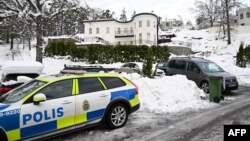 Police secure the area at a house where Swedish security services arrested Sergei Skvortsov on suspicions of espionage, in the Stockholm area, on November 22, 2022.