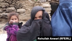 Saima (right), an Afghan widow, with her two daughters. Her husband was a Taliban fighter.