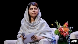 Nobel Peace Prize laureate Malala Yousafzai sits onstage after delivering the 21st Nelson Mandela Annual Lecture in Johannesburg on December 5.