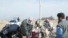 Iraqi security forces carrying out an inspection in Al-Najaf on January 8