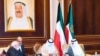 Kuwait's new Emir Sheikh Nawaf al-Ahmad Al-Sabah (R) receiving condolences from Iranian Foreign Minister Mohammed Javad Zarif (L) in Kuwait City.