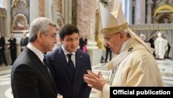 The Vatican - Pope Francis talks to Armenian President Serzh Sarkisian after a Mass in St. Peter's basilica, 12Apr2015.