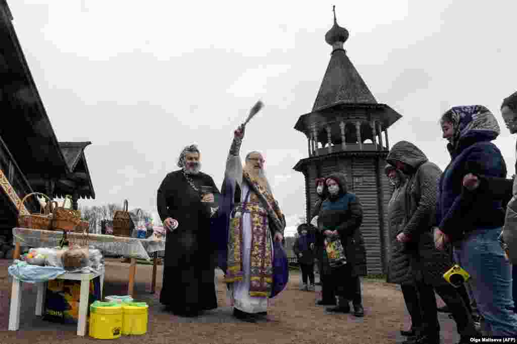 An Orthodox priest blesses traditional cakes and eggs at Pokrovsky Cathedral in St. Petersburg, Russia, on April 18.