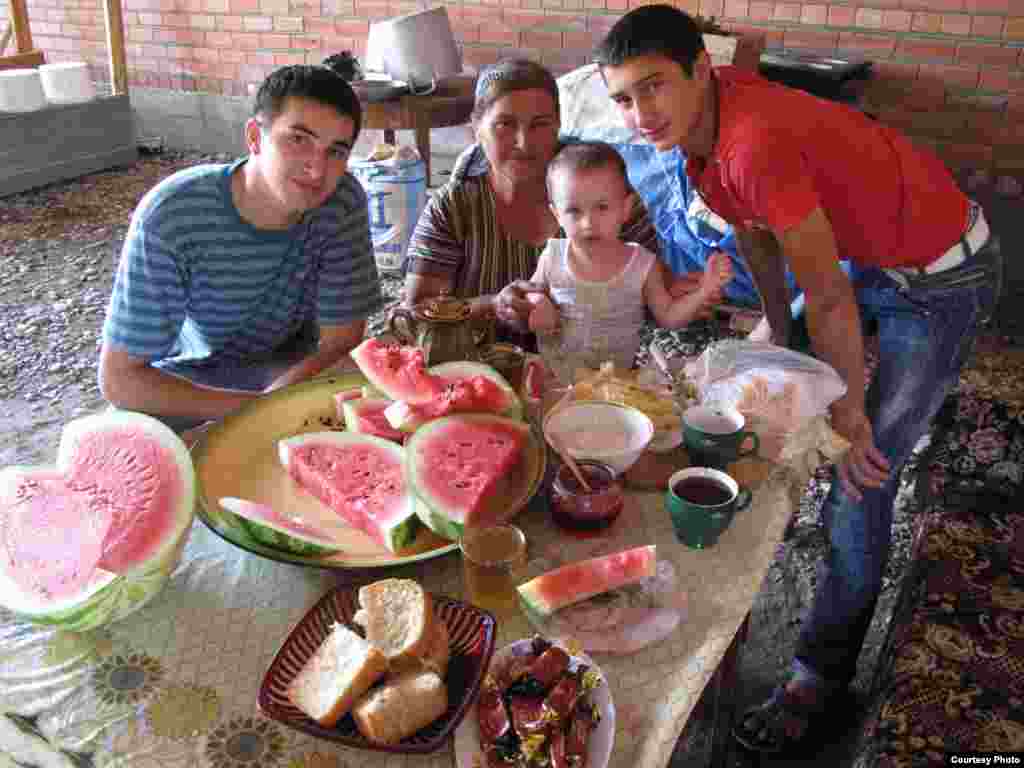 The family of one of Polacek's Chechen drivers: Yusup Shavluhanov (left), his mother, his son, and brother - "I was stunned by today's Chechnya. Before I got there, I was on the road for some 4,000 kilometers and for most of that time people would tell me: 'We know what it'll be like there. You'll be kidnapped and held for ransom or murdered or you won't be able to get in.' Then I arrived in Chechnya and it was...nice. In Grozny, everyone told me it was unbelievable. Six years ago Chechnya was a bombed-out city. And now I think it's the prettiest, most modern city in the whole region."