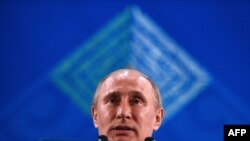 Russian President Vladimir Putin speaks during a press conference at the end of the G20 summit in Los Cabos, Mexico, on June 19.