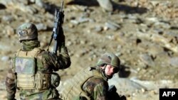 French soldiers take up positions during an operation in Afghanistan's Uzbin Valley. France has 4,000 troops in Afghanistan.