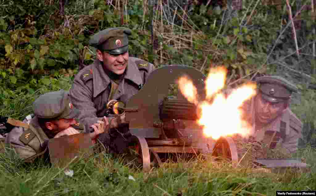 Men dressed as Russian Imperial Army servicemen take part in a reenactment of the battle between Germans and the Russian Imperial Army during World War I, near the village of Makarovtsy, Belarus. (Reuters/Vasily Fedosenko)