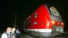 Police stand by the regional train on which a man allegedly wielding an axe attacked passengers in Wuerzburg, Germany on July 18