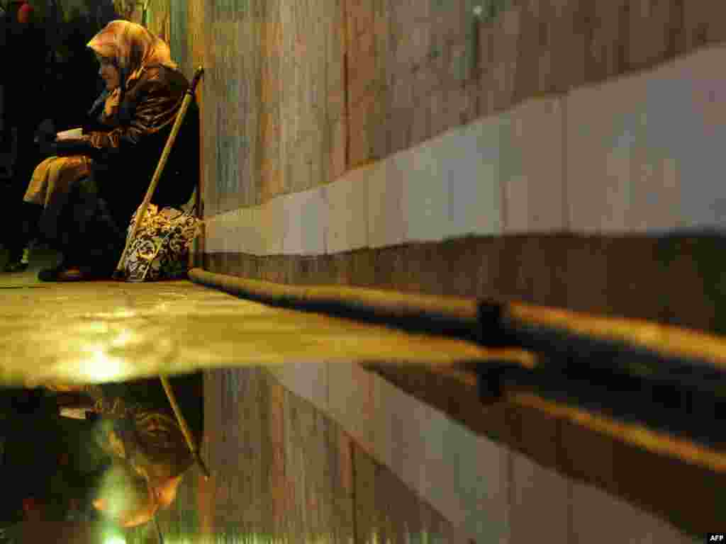 A woman begs for money in an underground passage in central Moscow. (Photo for AFP by Kirill Kudryavtsev)