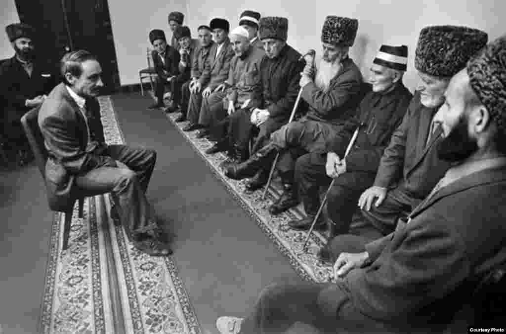 Chechnya. Future President Djokhar Dudaev at a meeting with elders whom he tries to persuade to pledge their support for him. 1991.
