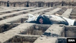 Addicts and homeless people who sleet in graves in Nasir Abad in Shahriar, near Tehran. File photo