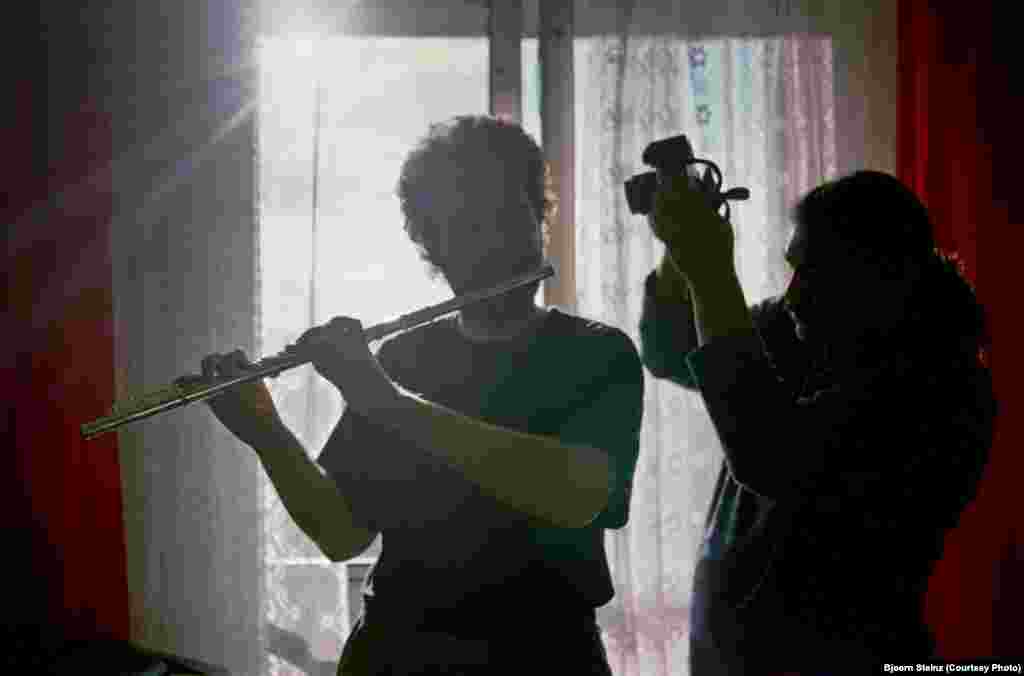 Bihari takes a picture of his university friend Jarek for a project titled "Music In Images." The project was documented by fellow photographer Bjorn Steinz, who collaborates with Bihari on his photographic work.