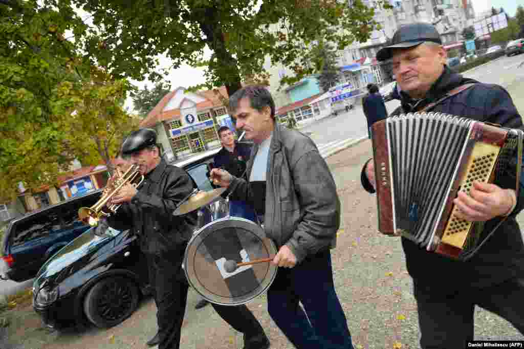 Musicians play at a wedding ceremony in Drochia.