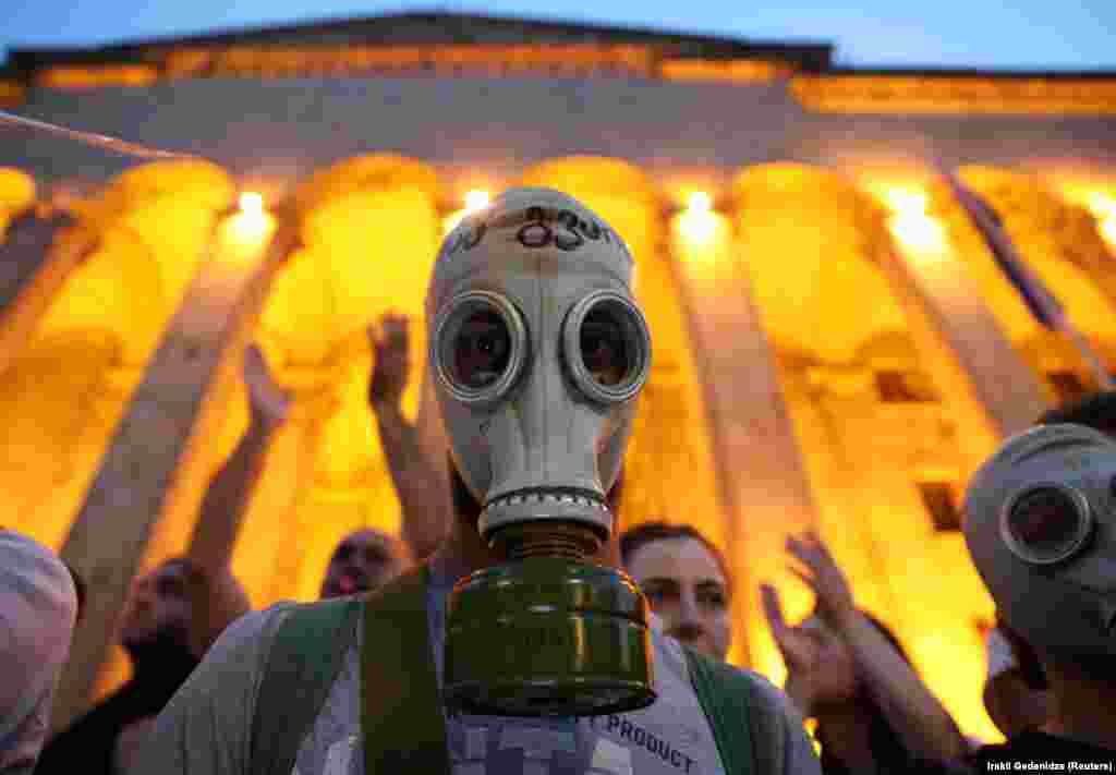 A protester attends a rally near Georgia&#39;s parliament building after a Russian lawmaker&#39;s visit to Tbilisi sparked a wave of demonstrations. (Reuters/Irakli Gedenidze)