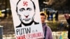 Жінка з плакатом «Путін – воєнний злочинець» під час акції з вимогою до Росії припинити війну проти України. Вільнюс, Литва, 2 березня 2022 року