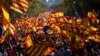 Spain -- Protesters wave Spanish and Catalan Senyera flags during a pro-unity demonstration in Barcelona on October 29, 2017