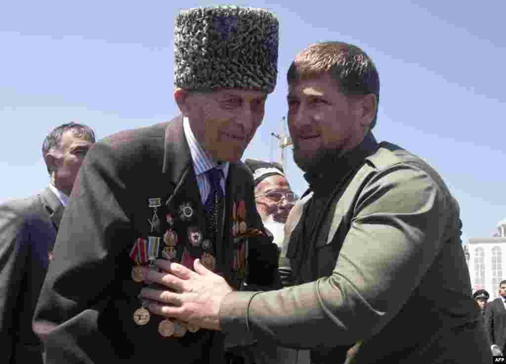 Chechen leader Ramzan Kadyrov (right) congratulates a World War II veteran in central Grozny.