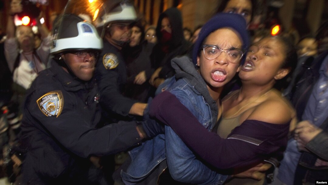 Members of the Occupy Wall Street movement clash with police officers after being removed from Zuccotti Park in New York in November. 