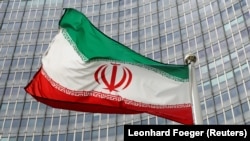 An Iranian flag in front of the International Atomic Energy Agency headquarters in Vienna. 