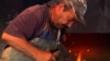 Igor Radic, a Slovak Rom, works at his forge in the village of Klenovec.