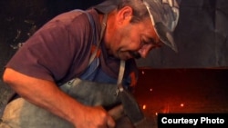 Igor Radic, a Slovak Rom, works at his forge in the village of Klenovec.