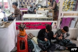 A tailoring shop in Kabul. Under the Taliban, male tailors are banned from making clothes for women.