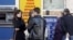 Depositors at an ATM in Kyiv in early October.