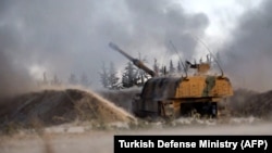 A Turkish self-propelled artillery gun reportedly fires at Syrian regime targets in Idlib province, February 28, 2020