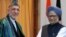 Indian Prime Minister Manmohan Singh (right) welcomes Afghan President Hamid Karzai to New Delhi on October 4.