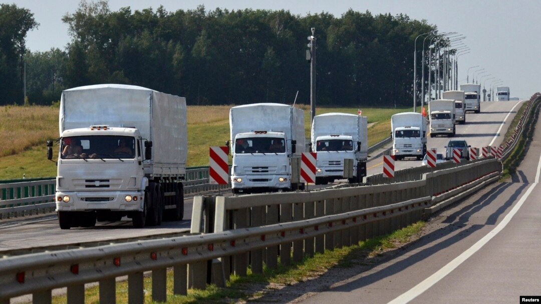 A Russian convoy of trucks bound for Ukraine drives along a road near the city of Yelets, Russia, on August 12.