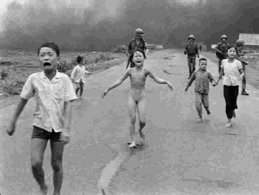 Nine-year old Phan Thi Kim Phuc (center) with other Vietnamese children after being severely burned by napalm on June 8, 1972, after a South Vietnamese plane erroneously dropped napalm on South Vietnamese troops and civilians. Kim Phuc became a symbol of civilian suffering during the war.