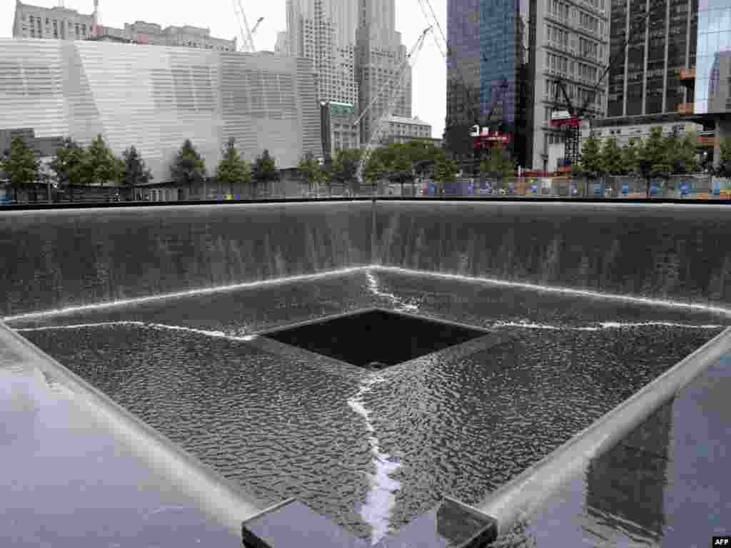 ...and in September 2011. The bases of the two towers are now square pools surrounding by newly planted trees, a museum devoted to the events of 9/11, and the names of the victims inscribed in bronze. 