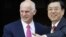 Greek Prime Minister George Papandreou (left) welcomes Chinese Vice Premier Zhang Dejiang to Athens on June 15.