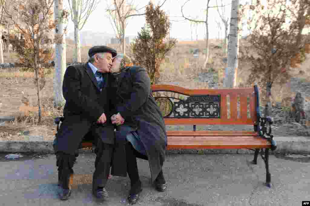 An elderly couple shares a tender moment in the Armenian capital, Yerevan. (AFP/Karen Minasyan)