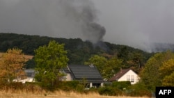 Fumul se ridică dintr-un incendiu forestier la Huertgenwald, pe 14 august 2026.
