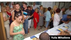 Moldovan voters at a polling station in Ialoveni on July 29