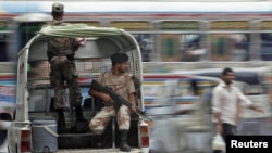 Troops keep guard at an intersection in Karachi 