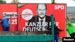 Социал-демократлар лидери Олаф Шольцнинг плакати.