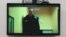 Aleksei Navalny is seen on a screen via video link during a court hearing in Moscow in April.
