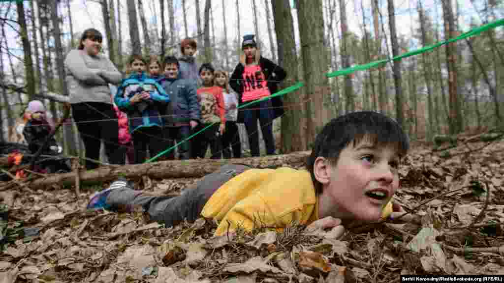 Crawling through a &ldquo;spider&#39;s web,&rdquo; during a quest game.&nbsp;