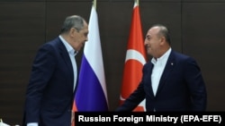 TURKEY -- Russian Foreign Minister Sergei Lavrov (L) and Turkish Foreign Minister Mevlut Cavusoglu attend a joint news conference following their talks in Antalya, June 30, 2021