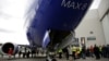 Renton, Washington, U.S. - Boeing employees are pictured in front of a 737 MAX 8 produced for Southwest Airlines as Boeing celebrates the 10,000th 737 to come off the production line, March 13, 2018. REUTERS/Jason Redmond