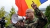 A speaker at the anti-Rogozin protest at Chisinau's international airport