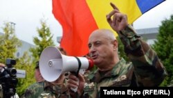 A speaker at the anti-Rogozin protest at Chisinau's international airport