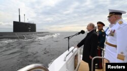 Russian President Vladimir Putin attends the Navy Day parade in St. Petersburg on July 25.