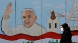 IRAQn-nA mural of Pope Francis is seen on the wall of a church upon his upcoming visit to Iraq, in Baghdad, Iraq February 22, 2021