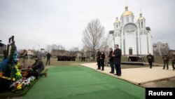Slovenia's Prime Minister Robert Golob, Ukraine's President Volodymyr Zelenskiy, Moldovan President Maia Sandu, Croatian Prime Minister Andrej Plenkovic, and Slovakian Prime Minister Eduard Heger attend a ceremony marking the first anniversary of the liberation of the town of Bucha, outside Kyiv, on March 31.