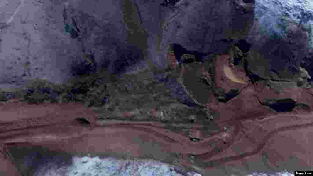 A close-up of the satellite image on the right shows damage to a large tunnel entrance.